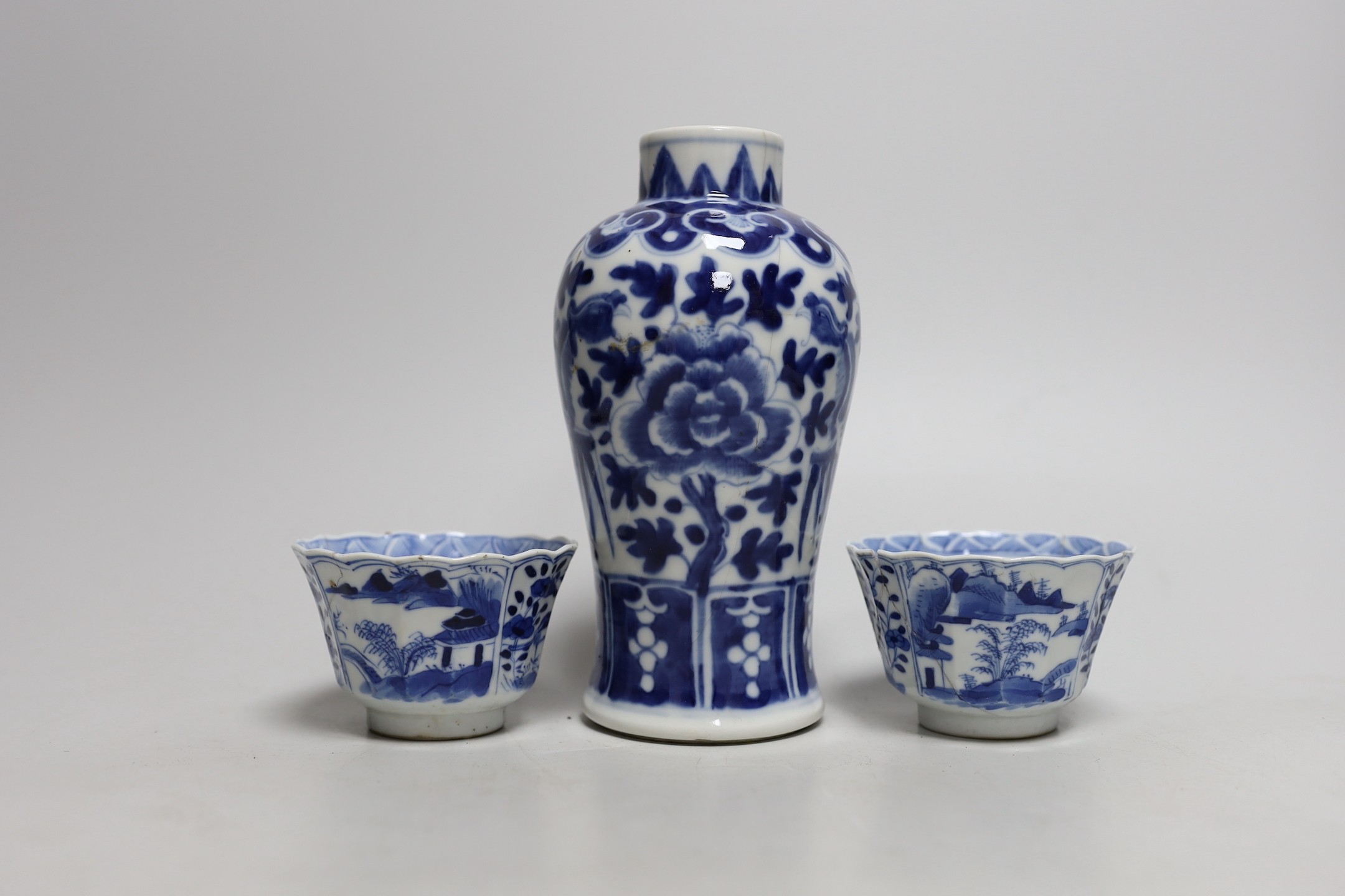 A Chinese blue and white phoenix decorated vase, a pair of circular boxes and a pair of damaged tea bowls. Late 19th century Tallest 17.5cm